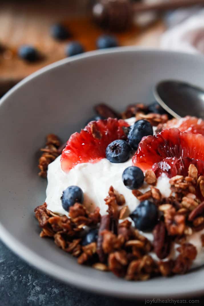 A healthy and Light Yogurt Breakfast Bowl filled with pops of flavor from sweet blood orange and tart blueberries then finished with homemade Vanilla Granola! You'll never want another breakfast again! | joyfulhealthyeats.com