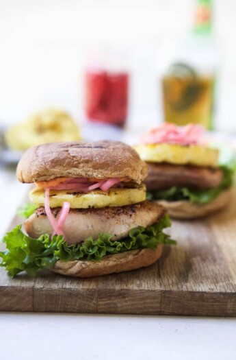 Blackened Mahi Mahi Fish Burger with a bun on a wooden board