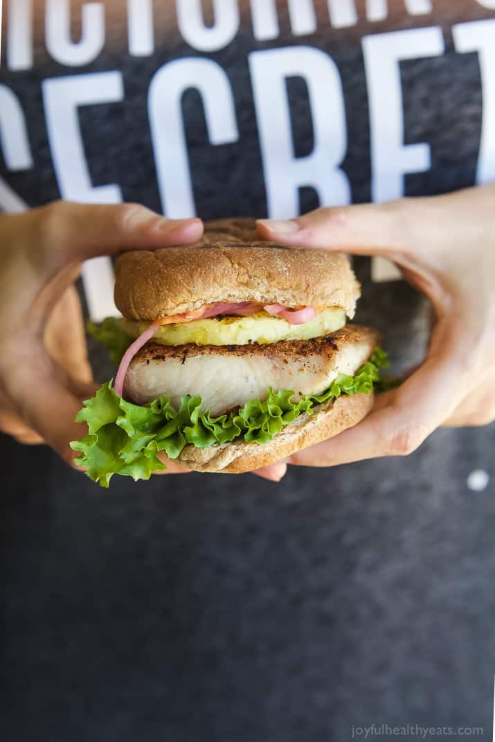 Blackened Mahi Mahi Fish Burger topped with grilled pineapple on a bun