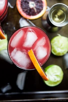 A simple Blood Orange Margarita that's friendly on the waist using no simple syrup. This Margarita Recipe is the perfect party drink - it's fresh, citrus-y, packs a flavor punch and makes enough for a crowd! | joyfulhealthyeats.com