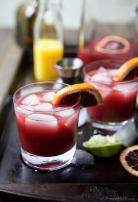 A simple Blood Orange Margarita that's friendly on the waist using no simple syrup. This Margarita Recipe is the perfect party drink - it's fresh, citrus-y, packs a flavor punch and makes enough for a crowd! | joyfulhealthyeats.com