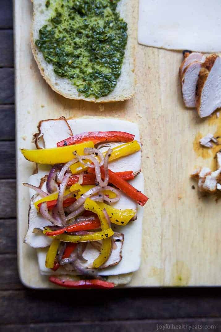 Top view of ingredients for Grilled Chicken Fajita Panini on bread slices