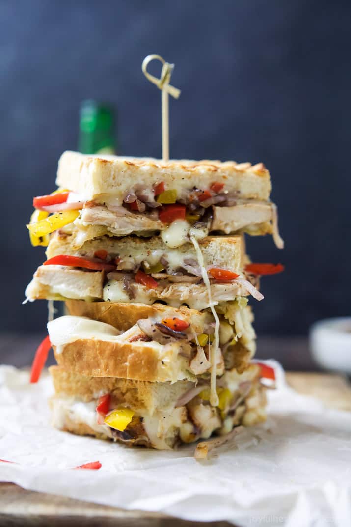 A Grilled Chicken Fajita Panini filled with juicy spice rubbed chicken, grilled peppers and onions, creamy fontina cheese, and zesty chimichurri for the perfect sandwich bite. You'll want this sandwich for lunch AND dinner! | joyfulhealthyeats.com