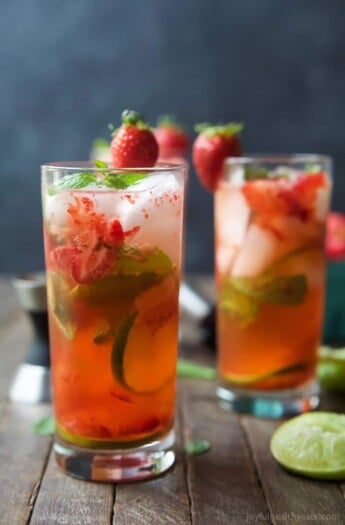 The perfect Strawberry Mojito Recipe - easy, fresh, minty, fizzy, limey and filled with sweet juicy strawberries for the most refreshing cocktail this summer! It is sure to quench your thirst! | joyfulhealthyeats.com