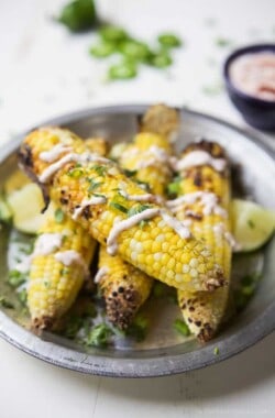 Mexican Corn just got blown out of the water! This Easy Grilled Corn on the Cob is topped with a Creamy Roasted Jalapano Sauce you'll swoon over! This grilled corn is the new star of the summer! | joyfulhealthyeats.com #glutenfree