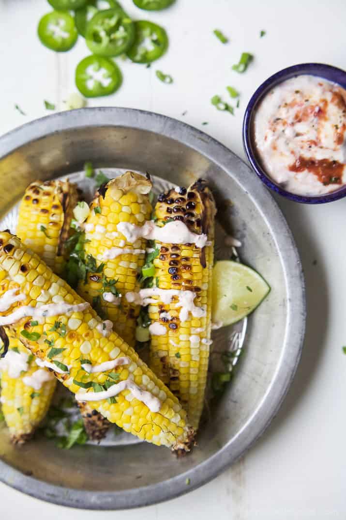 Top view of several ears of Grilled Corn on the Cob with Creamy Roasted Jalapeno Sauce