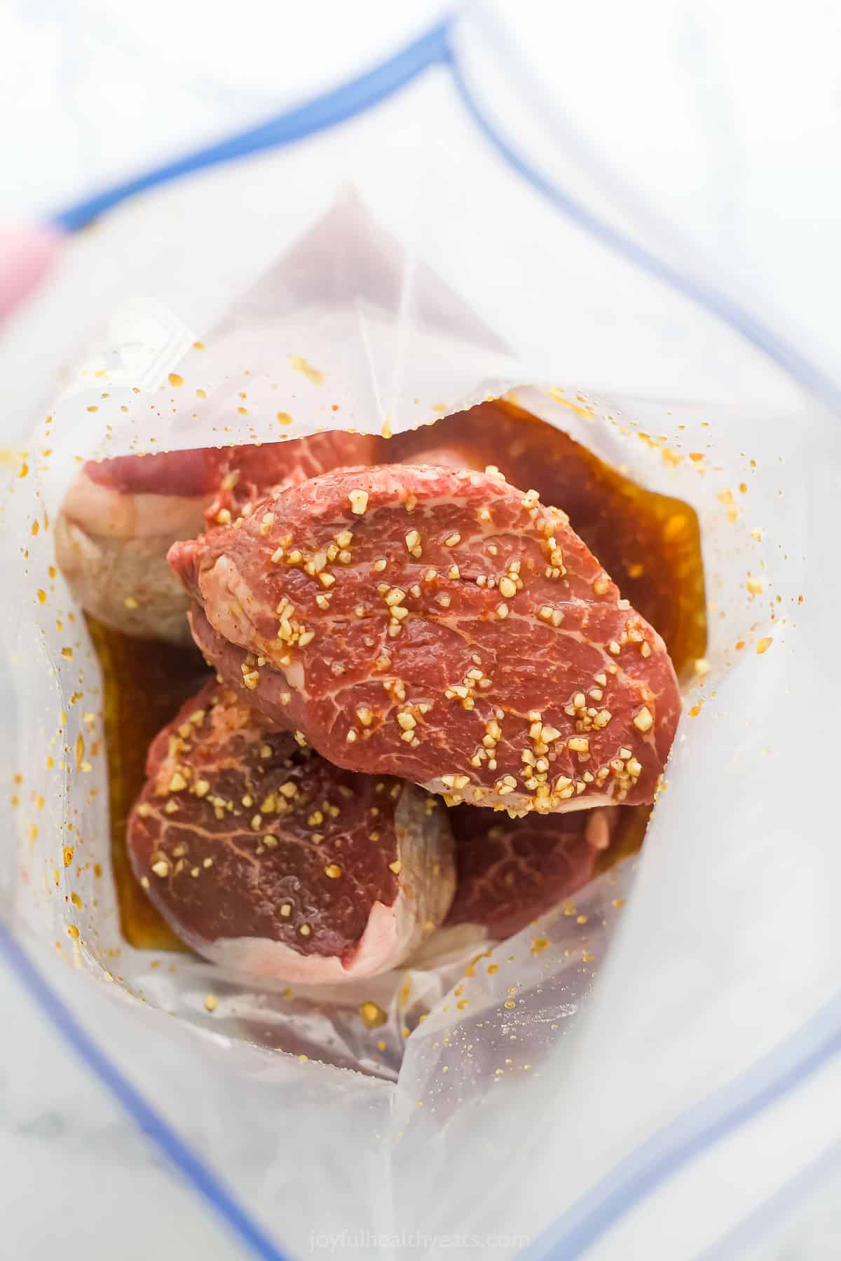 Marinating the steak. 