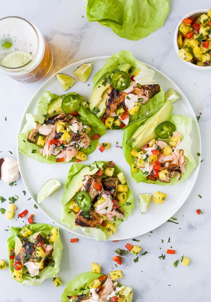 salmon tacos with pineapple salsa on a plate