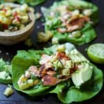 The perfect healthy twist on the original fish tacos! These Southwestern Grilled Salmon Tacos are bursting with flavor and topped with fresh pineapple salsa and a Chipotle Lime Crema! Addicting! | joyfulhealthyeats.com
