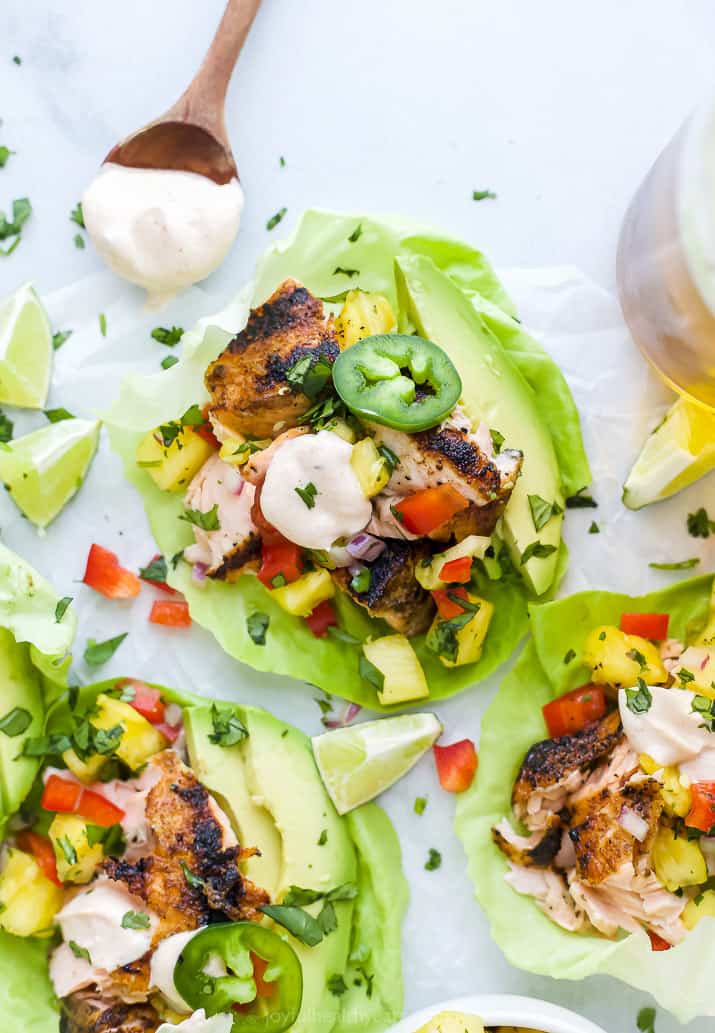 closeup of grilled salmon taco in a lettuce wrap