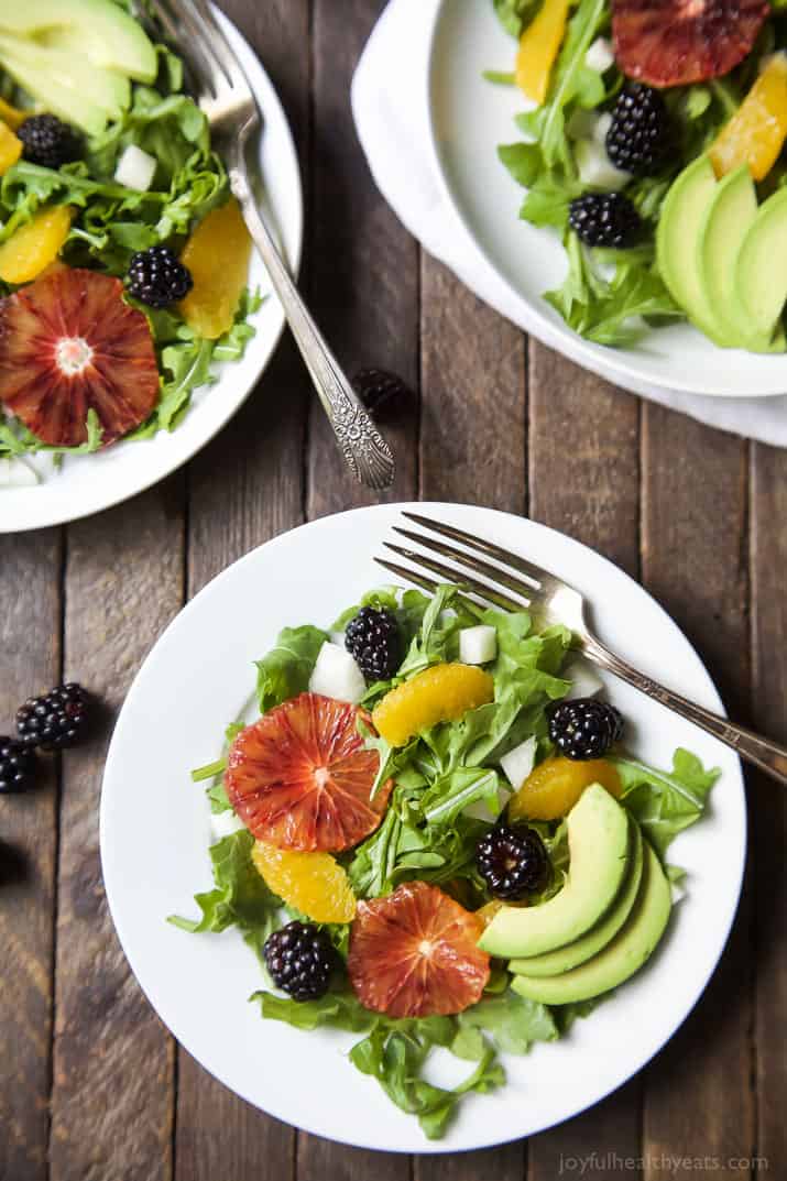 Summer Citrus Avocado Salad filled with fresh blackberries, avocado, spicy arugula, and vibrant citrus then finished with a Citrus Vinaigrette. This Salad is light, refreshing, low calorie, and takes minutes to make! | joyfulhealthyeats.com #glutenfree #vegetarian #paleo