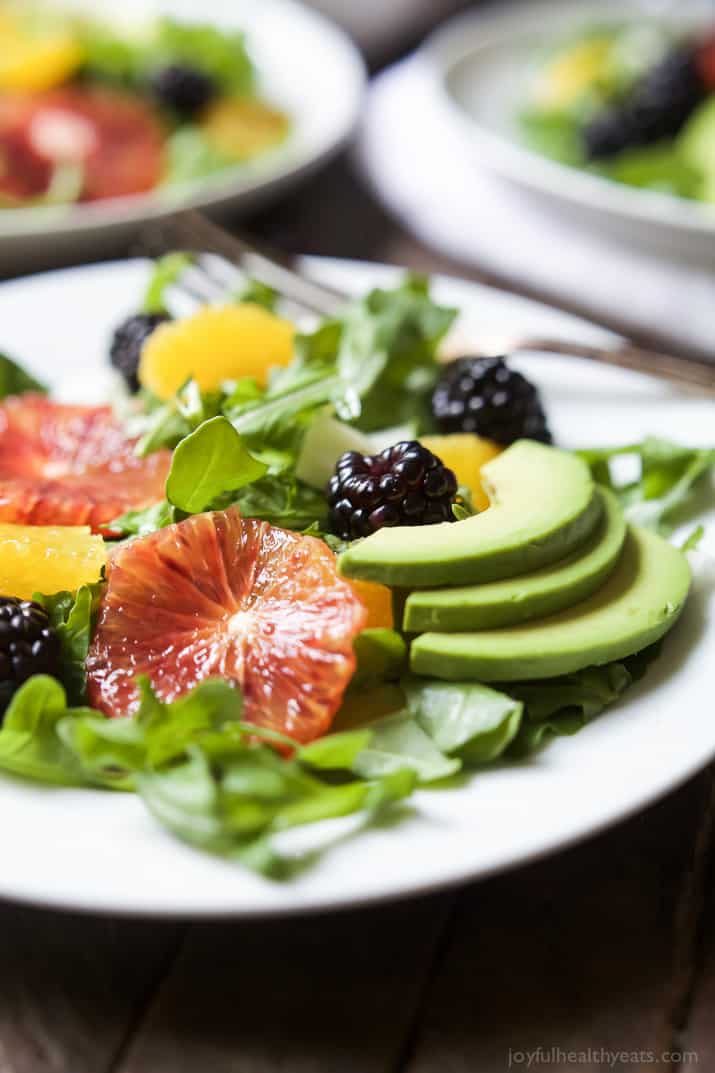 Summer Citrus Avocado Salad filled with fresh blackberries, avocado, spicy arugula, and vibrant citrus then finished with a Citrus Vinaigrette. This Salad is light, refreshing, low calorie, and takes minutes to make! | joyfulhealthyeats.com #glutenfree #vegetarian #paleo