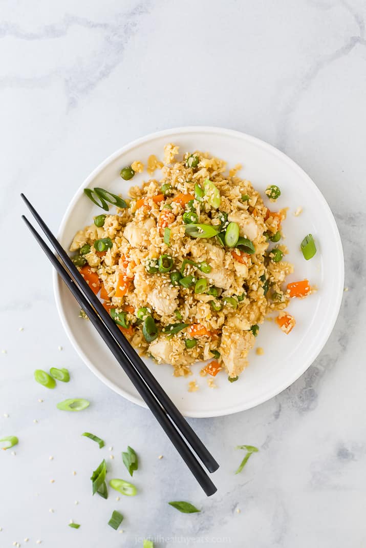 low carb chicken fried rice on a plate with chopsticks