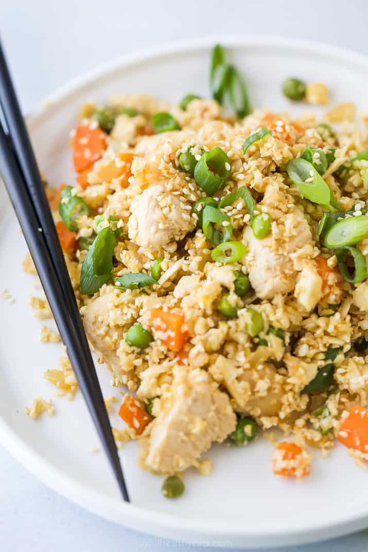 cauliflower fried rice with chicken on a plate