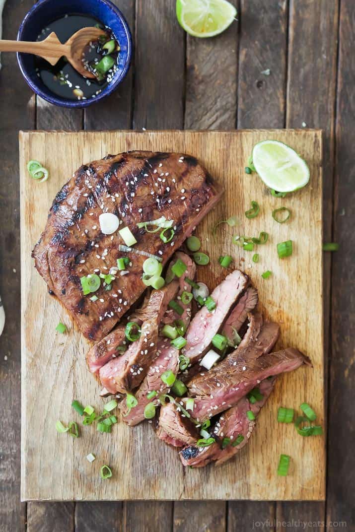 Top view of Asian Grilled Flank Steak on a cutting board