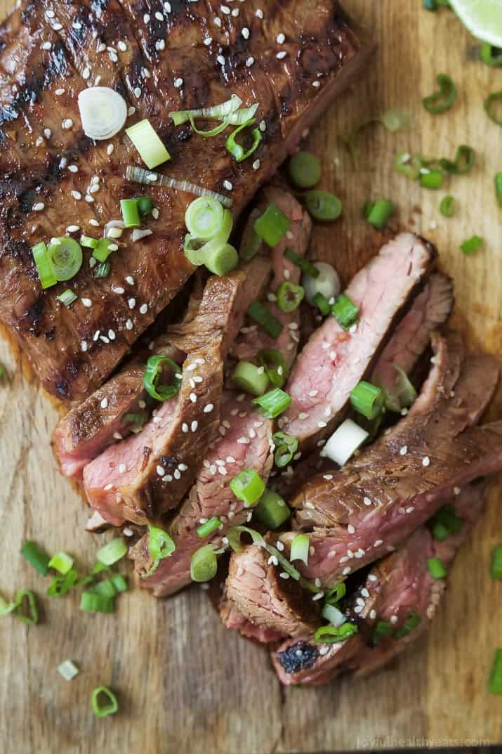 Top view of Asian Grilled Flank Steak on a cutting board