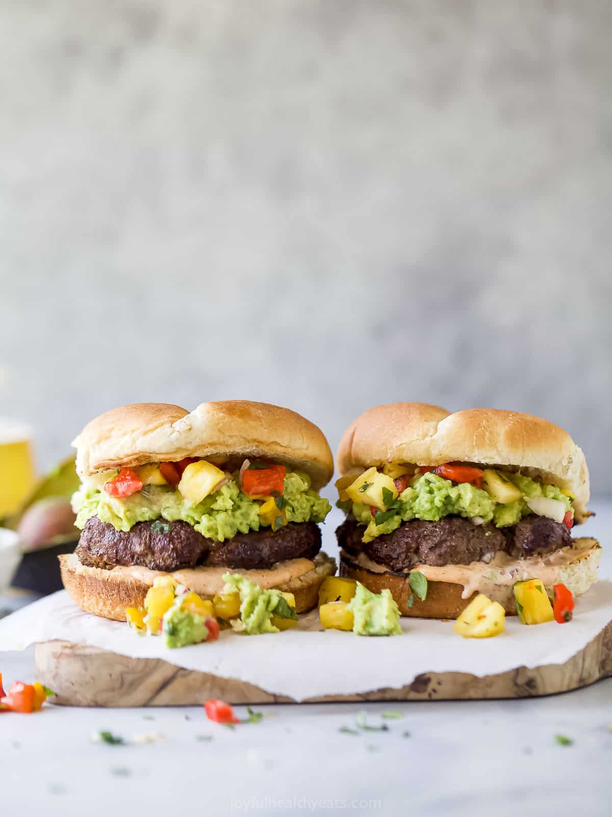 Two avocado hamburgers.