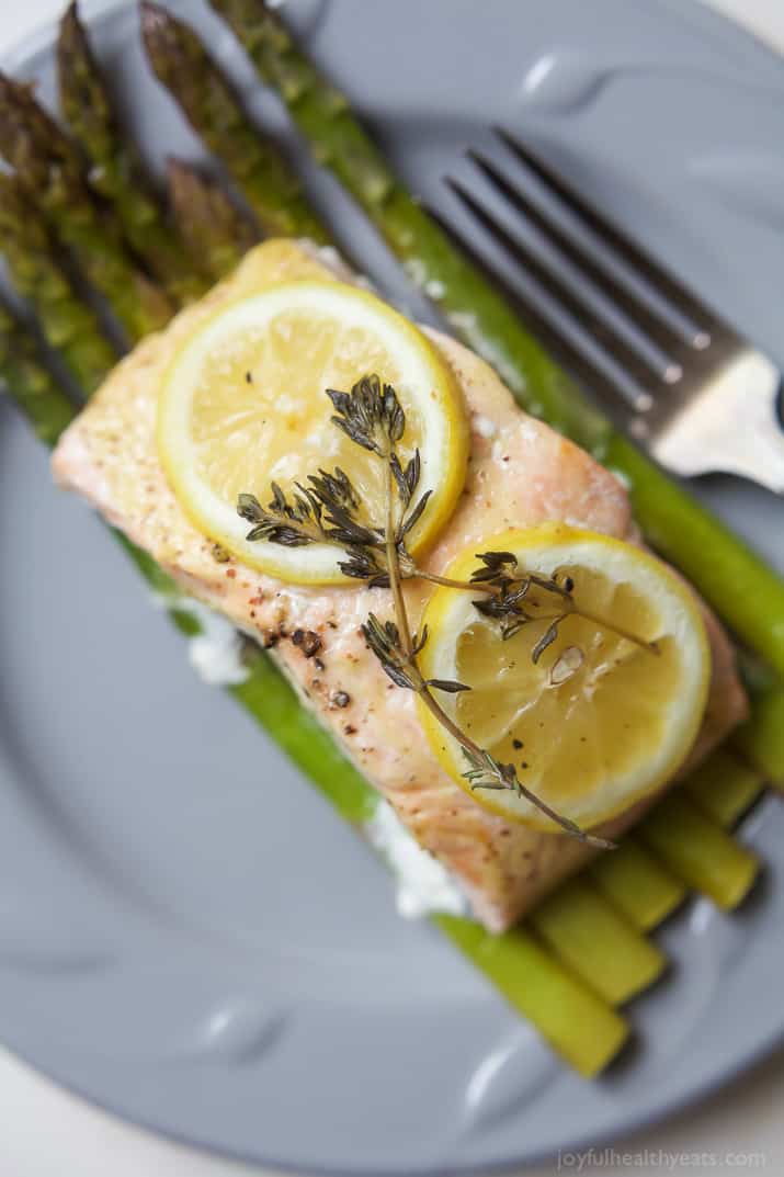 Citrus Asparagus & Salmon in Foil - so easy to make, loaded with roasted garlic and citrus flavor, plus clean up is a breeze! Dinner has never been easier! | joyfulhealthyeats.com #paleo #glutenfree