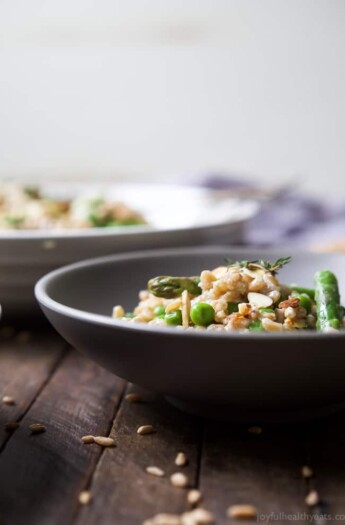 Creamy Springtime Farro Salad for the win! The perfect side dish filled with sweet peas, asparagus, fresh herbs and goat cheese! I guarantee you'll be addicted after the first bite! | joyfulhealthyeats.com