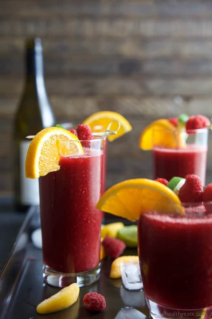 Frozen Raspberry Peach Sangria in glasses garnished with fruit