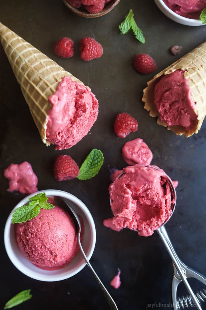 Lemon Raspberry Frozen Yogurt in a waffle cone, a bowl, and an ice cream scoop