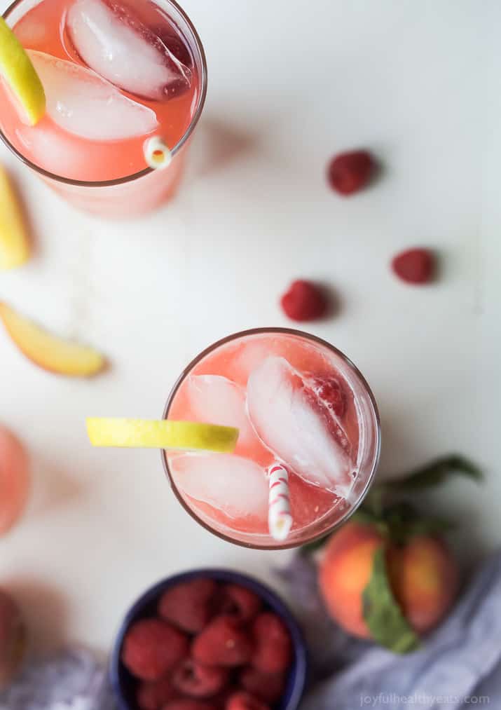 A Homemade Raspberry Peach Lemonade Recipe made with fresh raspberries and peaches for the ultimate refreshing drink to cool you down this summer! | joyfulhealthyeats.com 
