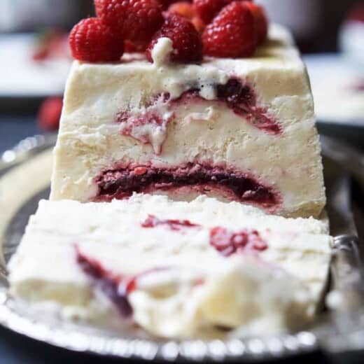 Indulgent Raspberry Amaretto Semifreddo, it's everything ice cream wishes it could be - light, creamy, and airy. This dessert is perfect for the summer and you'll love the secret sauce nestled inside every bite!| joyfulhealthyeats.com #glutenfree #ad #dairyfree