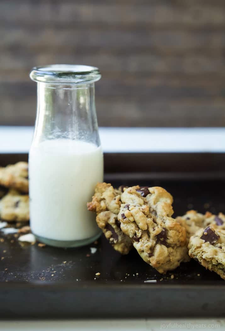 Toasted Coconut Chocolate Chunk Cookies that are soft, chewy, oozing with chocolate goodness all while using LESS butter and sugar! I guarantee you'll want to hoard these cookies! | joyfulhealthyeats.com 