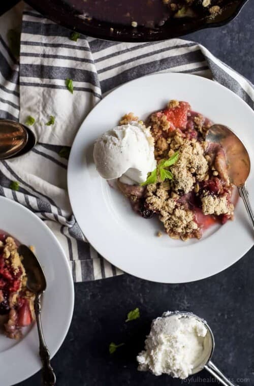 Nothing screams summer like fresh berries! This Very Banana Berry Crumble is loaded with bananas, 3 different kinds of berries and topped with a buttery crunchy crumble for the ULTIMATE dessert! | joyfulhealthyeats.com