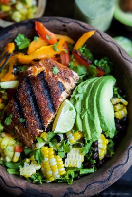 Blackened Grilled Salmon Salad topped with grilled corn, black beans, fresh Pineapple Salsa and a Citrus Cilantro Vinaigrette you'll swoon over! This Salad is what dreams are made of and all packed into a small bowl! | joyfulhealthyeats.com #paleo #glutenfree