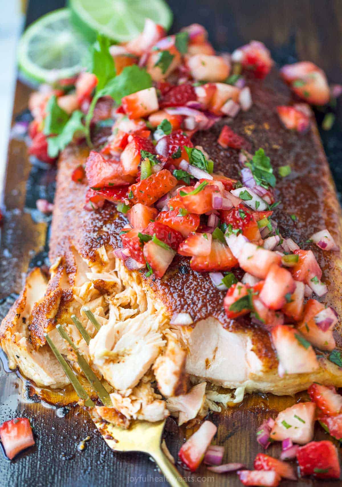 Flaked salmon with salsa on top.