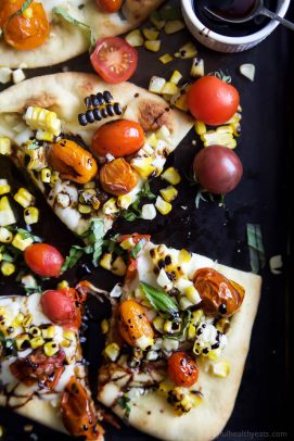 An easy delicious Charred Corn Caprese Flatbread topped with sweet Balsamic Reduction - it screams summer, takes 30 minutes to make, and uses less than 10 ingredients! You're gonna love it! | joyfulhealthyeats.com