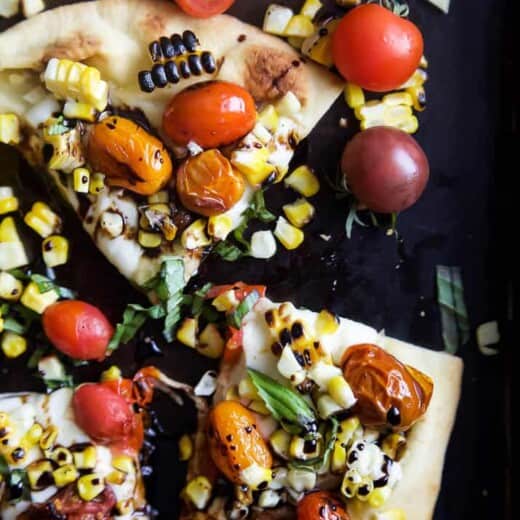 An easy delicious Charred Corn Caprese Flatbread topped with sweet Balsamic Reduction - it screams summer, takes 30 minutes to make, and uses less than 10 ingredients! You're gonna love it! | joyfulhealthyeats.com