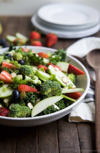 Image of a Detox Summer Salad with Citrus Basil Vinaigrette on a Plate with a Wooden Spoon