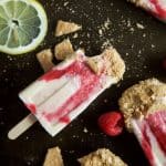 Lemon Raspberry Cheesecake Popsicles, creamy, lemony and filled with fresh fruit. The perfect refreshing treat to cool you down this summer, they taste just like biting into a real cheesecake except half the calories! | joyfulhealthyeats.com