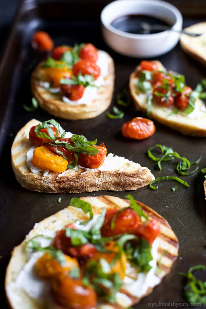 Roasted Tomato Bruschetta with Whipped Goat and a Balsamic Reduction Drizzle - an appetizer that everyone will love and only takes minutes to make! | joyfulhealthyeats.com