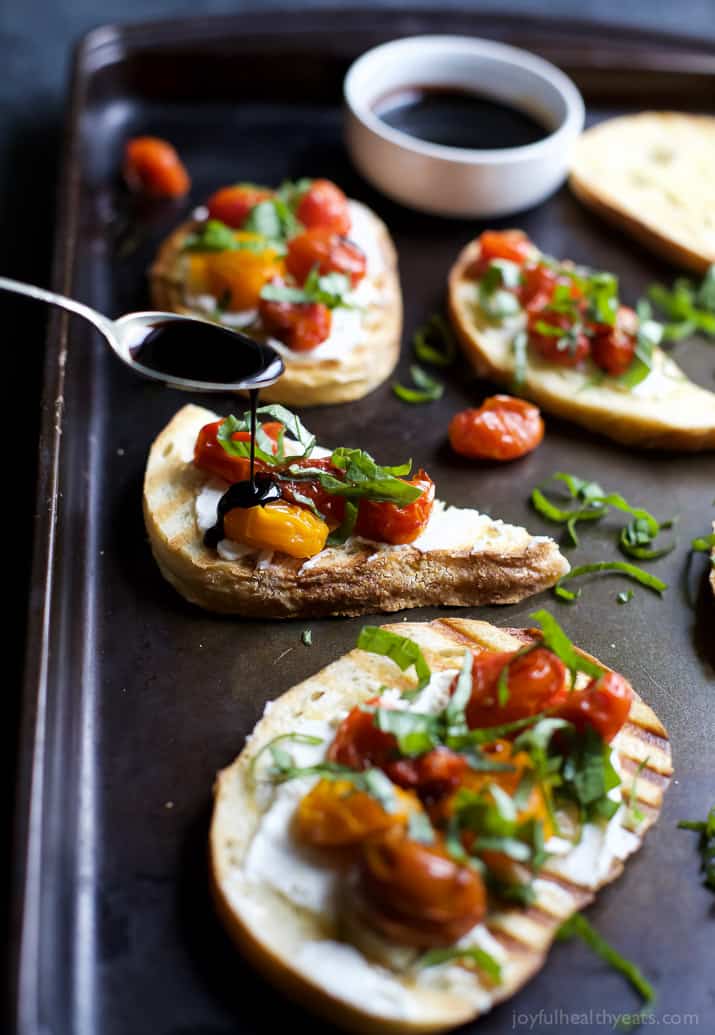 Roasted Tomato Bruschetta with Whipped Goat and a Balsamic Reduction Drizzle - an appetizer that everyone will love and only takes minutes to make! | joyfulhealthyeats.com