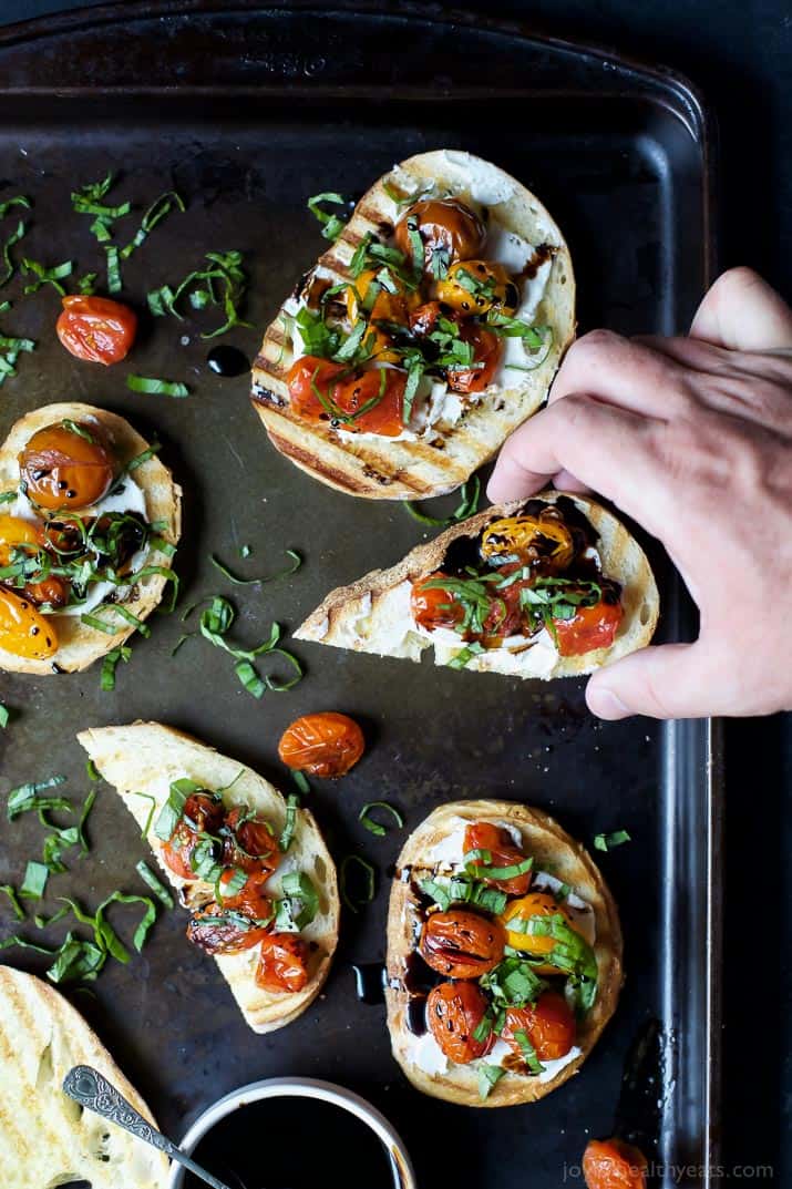 Roasted Tomato Bruschetta with Whipped Goat and a Balsamic Reduction Drizzle - an appetizer that everyone will love and only takes minutes to make! | joyfulhealthyeats.com