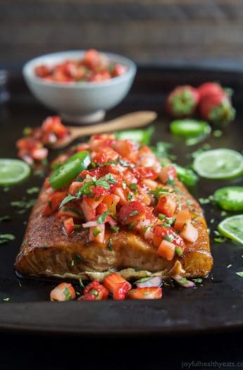 Spice Rubbed Cedar Plank Salmon topped with a refreshing Strawberry Salsa. This Salmon is the ultimate summer main dish and definitely a crowd pleaser! | joyfulhealthyeats.com #glutenfree