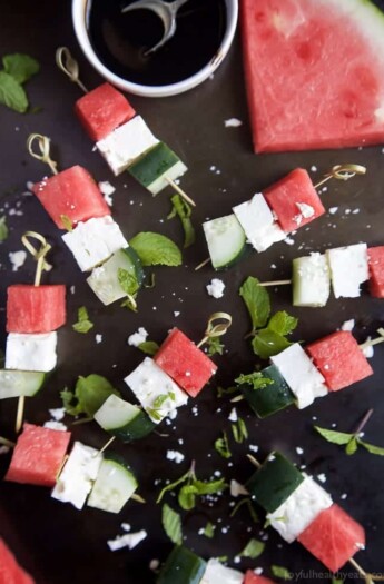 Watermelon Feta Bruschetta, the easiest appetizer recipe you'll ever make! Watermelon, Cucumber, and Feta Cheese all skewered together and topped with a sweet Balsamic Reduction that'll blow your mind. A must this summer! | joyfulhealthyeats.com #glutenfree