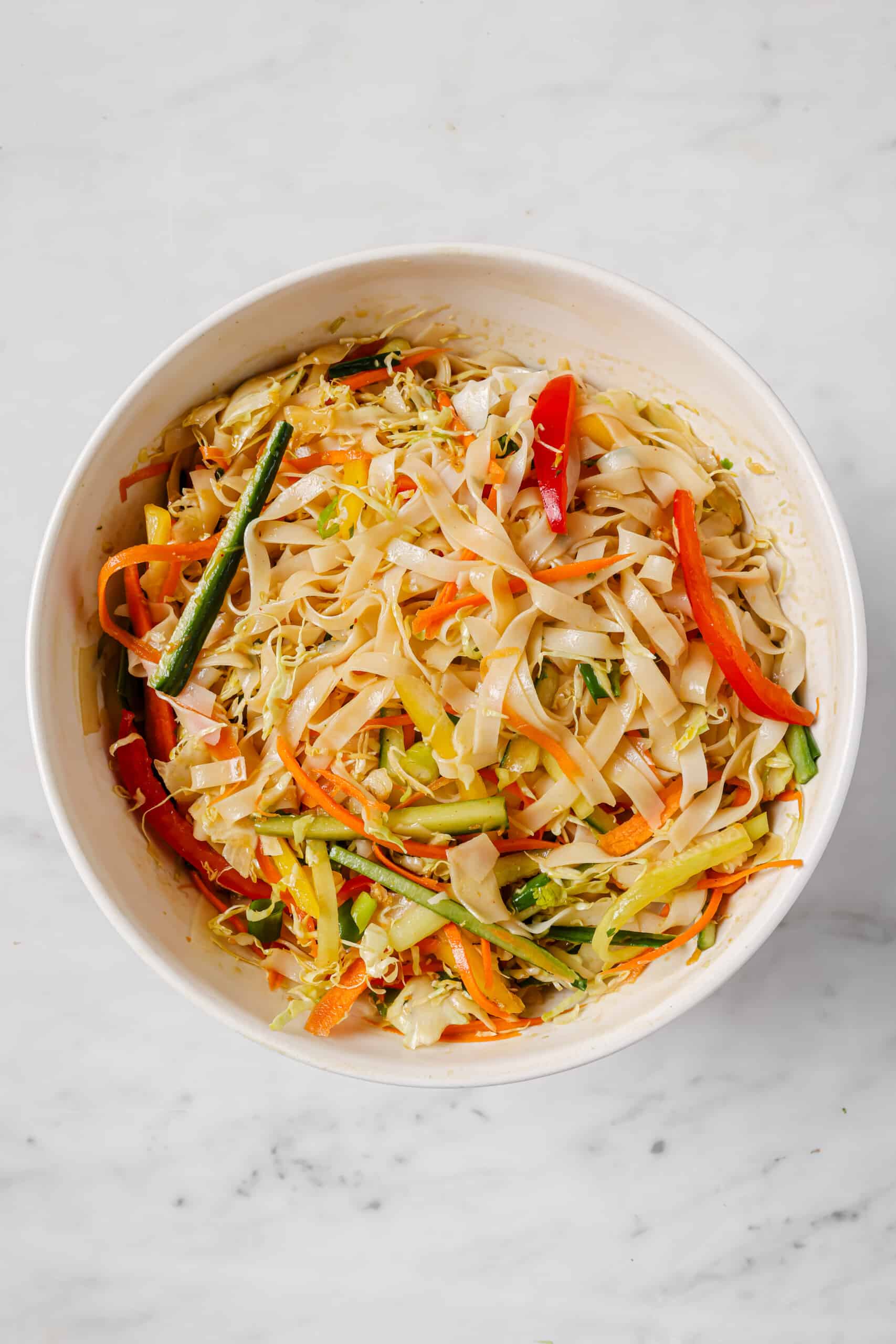 Tossed noodles with veggies and dressing.