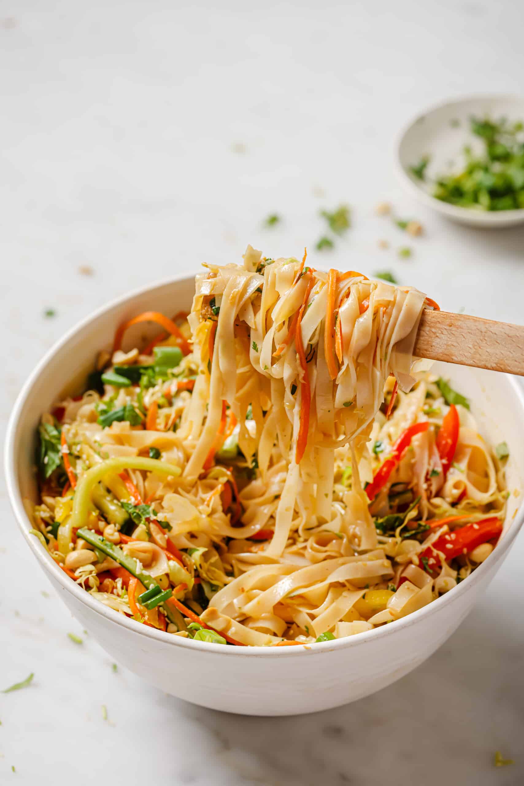 Grabbing noodles with chopsticks. 