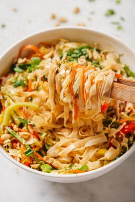 Grabbing Asian noodle salad with chopsticks.