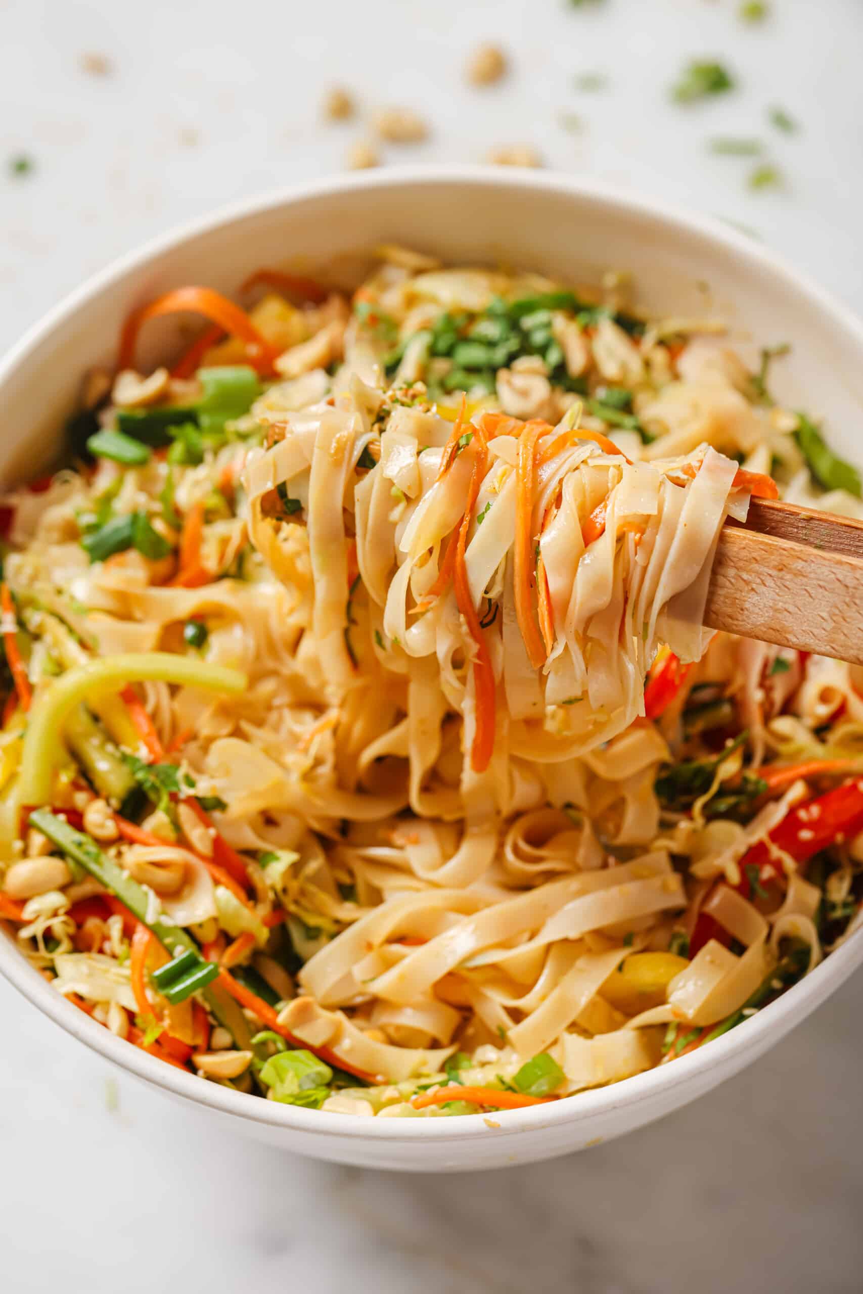 Grabbing Asian noodle salad with chopsticks. 