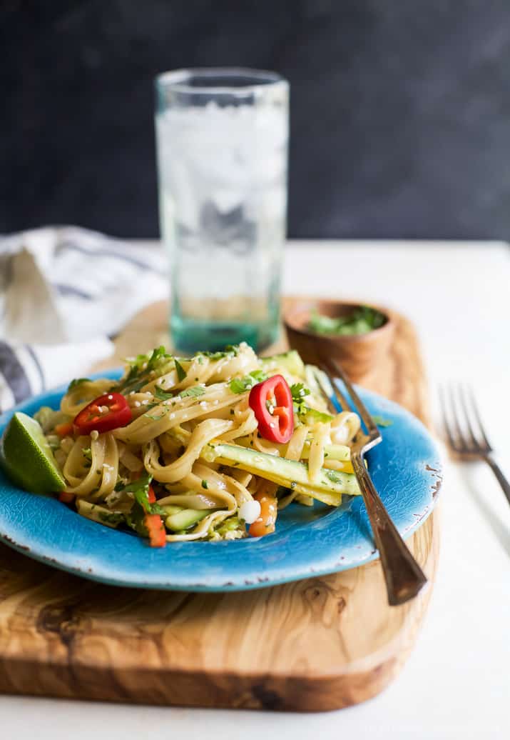 Asian Noodle Salad with julienned vegetables and a Spicy Sesame Dressing in a bowl