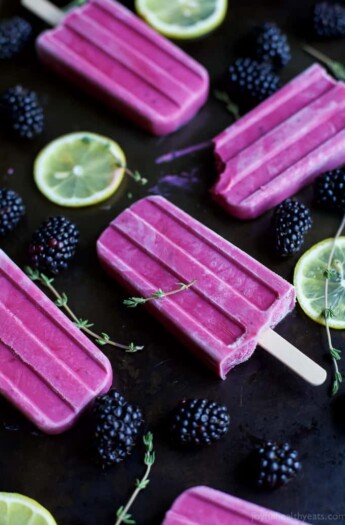 Blackberry Thyme Yogurt Popsicles, a frozen treat that will make your taste buds dance with excitement! Less than 5 minutes to make, 5 ingredients and under 75 calories a serving! Woot! | joyfulhealthyeats.com #glutenfree