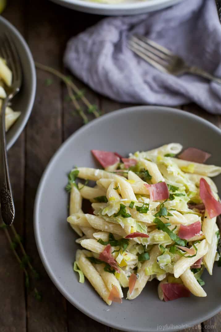 Top view of a bowl of Creamy Lemon Pasta with Prosciutto