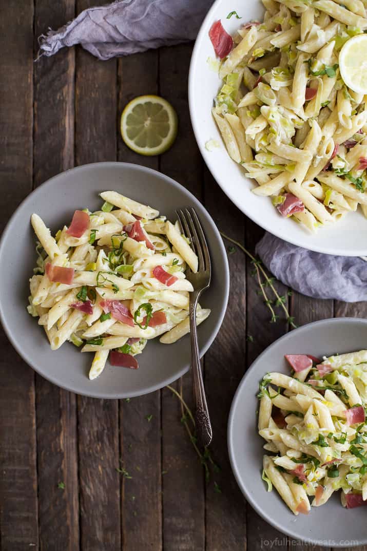 Top view of several bowls of Creamy Lemon Pasta with Prosciutto