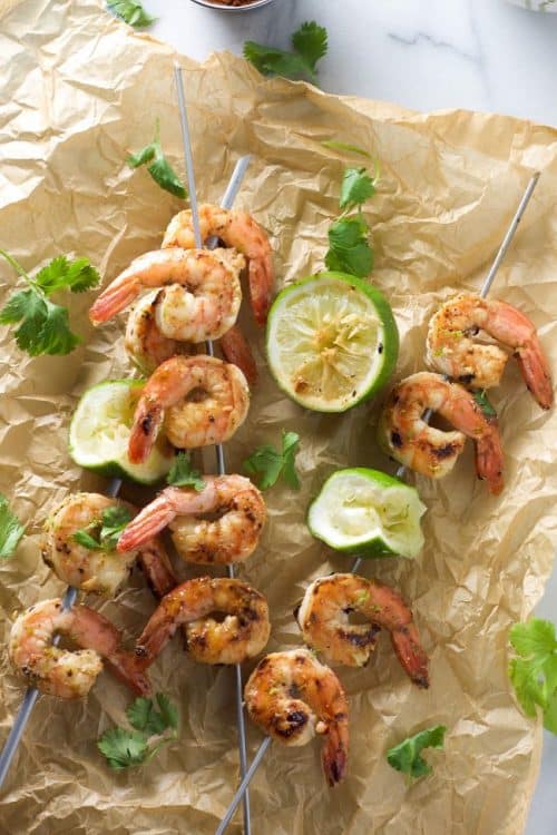 Sweet and saucy spicy cilantro shrimp skewers are ready in 20 minutes and dunked into a honey lime sauce! Healthy and bursting with flavor!