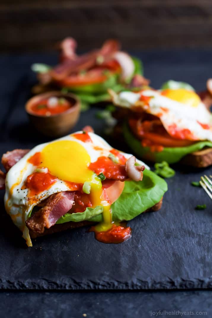 A Close-Up Shot of an Open Faced BLT Sandwich on a Black Serving Platter